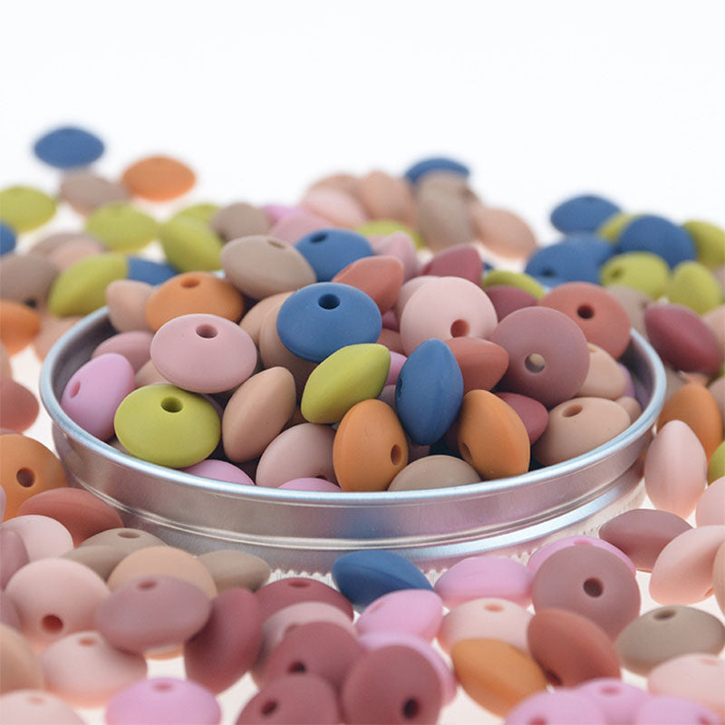 Venta al por mayor DIY 12mm Cuentas planas de silicona Color aleatorio 100pcs OLY-BDS-BX001